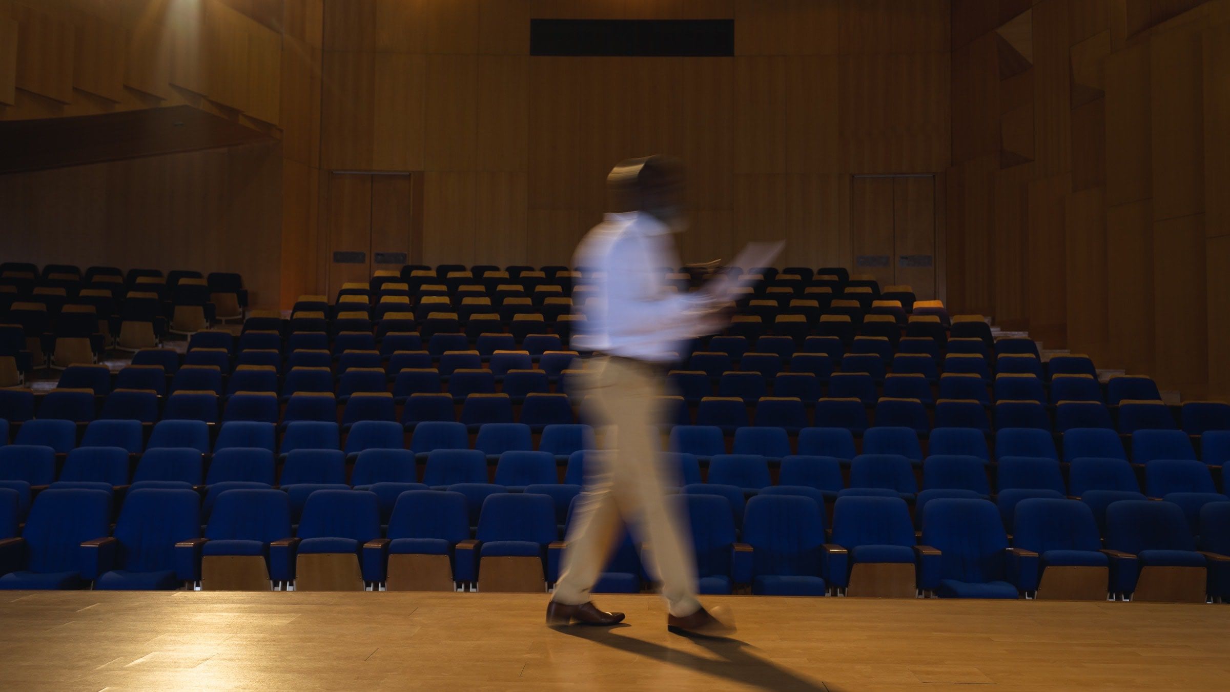 Man walking on stage