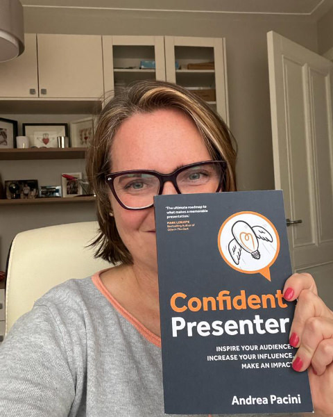 Reader 3 selfie holding Confident Presenter book in front of him
