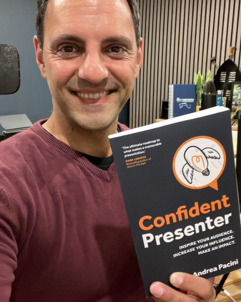 Reader 4 selfie holding Confident Presenter book in front of him
