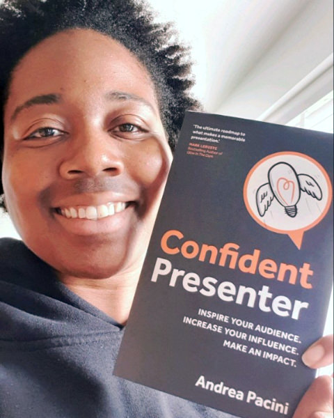 Reader 5 selfie holding Confident Presenter book in front of him