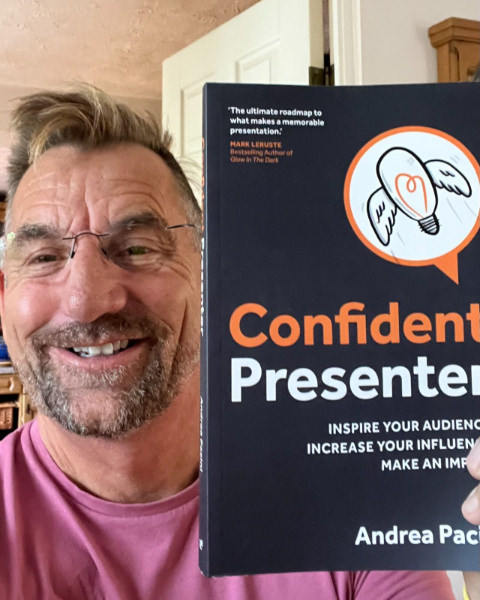 Reader 6 selfie holding Confident Presenter book in front of him